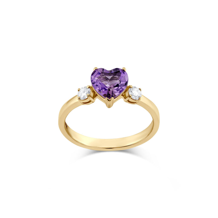 A luxurious 14k yellow gold ring featuring a 7mm heart-shaped amethyst and 2 sparkling diamonds. CHC Fine Jewelry.