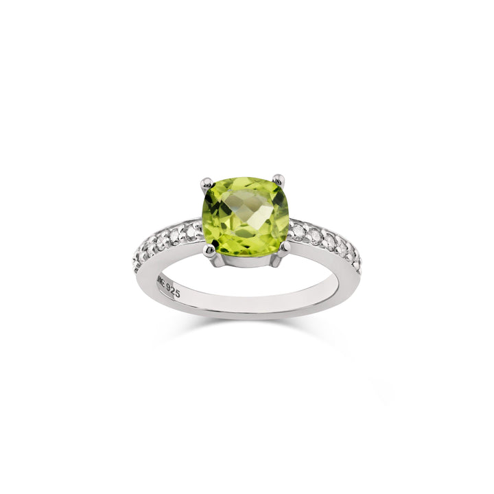 A luxurious sterling silver ring featuring a 7mm cushion-cut peridot and 12 sparkling diamonds. CHC Fine Jewelry.