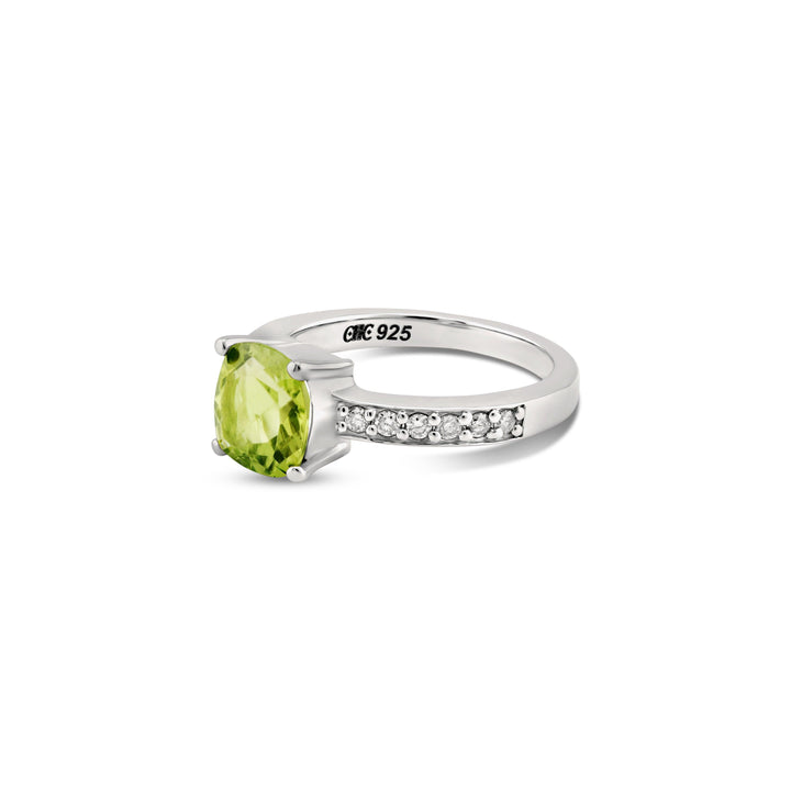 Close-up of the sterling silver ring highlighting the vibrant peridot and brilliant diamonds. CHC Fine Jewelry.